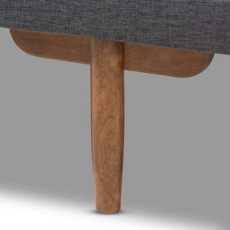 Tapicerowane łóżko dzienne w stylu mid-century modern z pikowaną tkaniną i drewnianymi nogami
