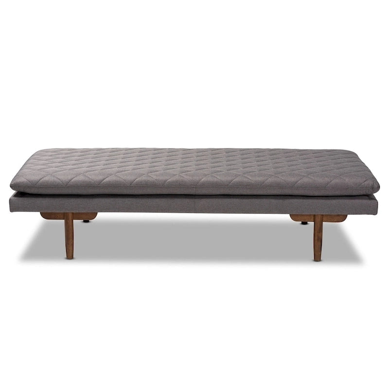 Tapicerowane łóżko dzienne w stylu mid-century modern z pikowaną tkaniną i drewnianymi nogami