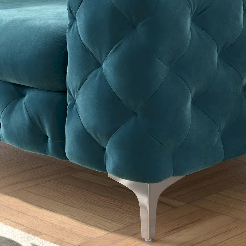Poltrona club Chesterfield in velluto trapuntato con gambe cromate a L – Vari colori
