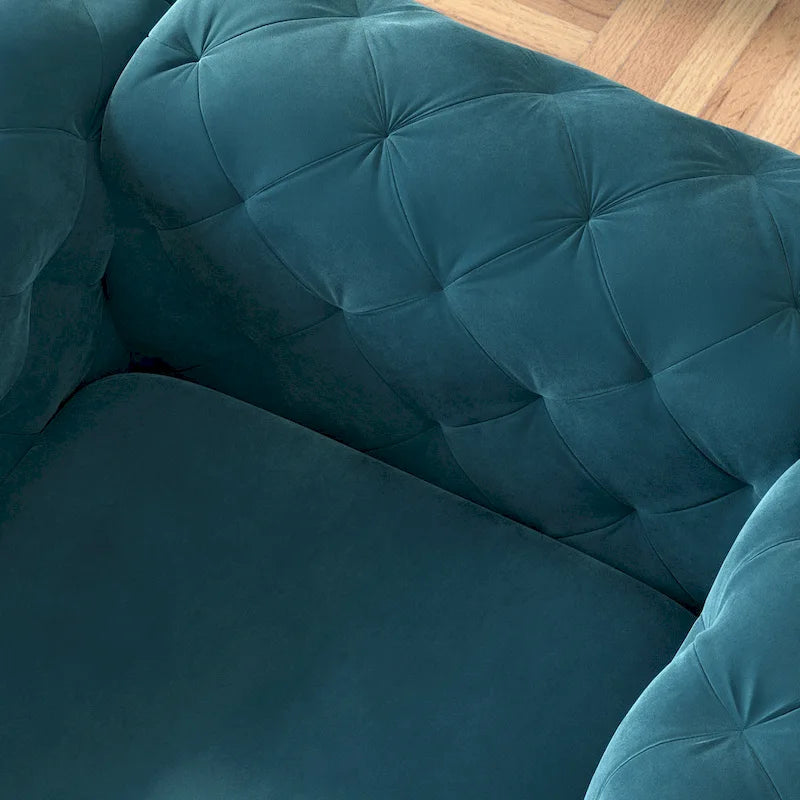 Poltrona club Chesterfield in velluto trapuntato con gambe cromate a L – Vari colori