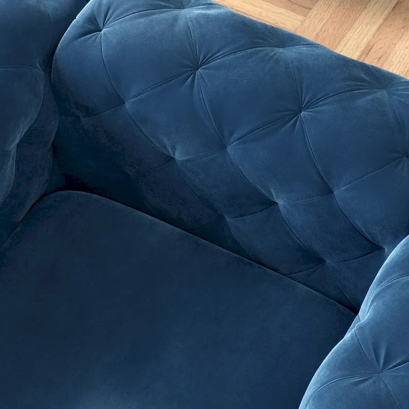 Poltrona club Chesterfield in velluto trapuntato con gambe cromate a L – Vari colori
