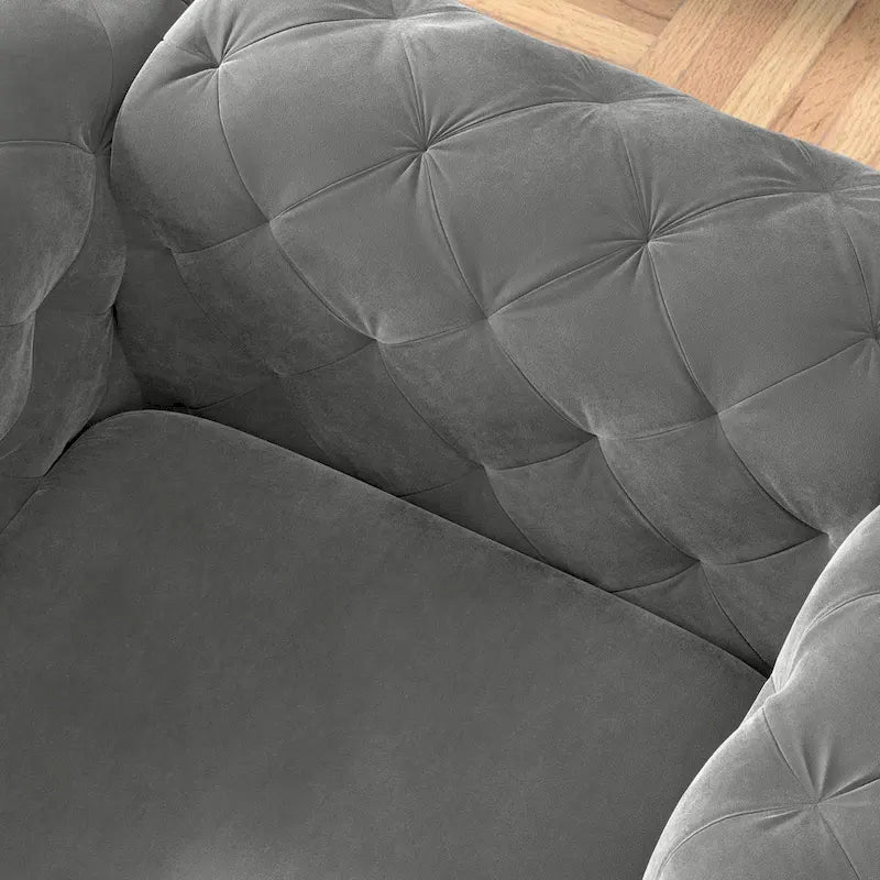 Poltrona club Chesterfield in velluto trapuntato con gambe cromate a L – Vari colori